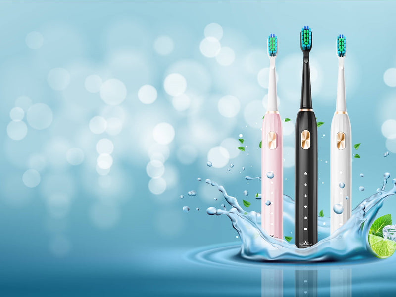 Pink, black and white Electric Toothbrush standing in water with splashes.