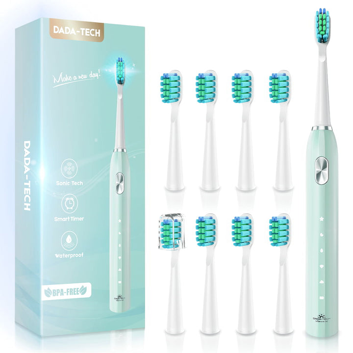 Dada-Tech green electric toothbrush with 8 extra brush heads (one with brush cap) and a package